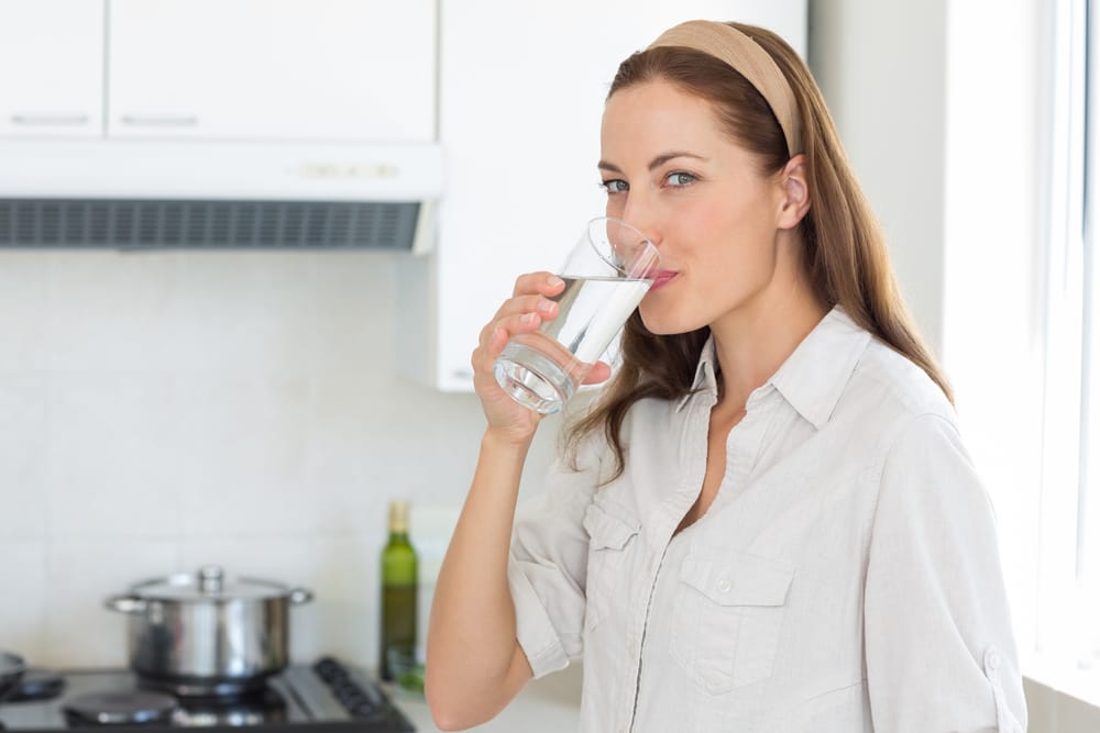 Woman Drinking Water Glass - SoftPro Water Filters and Purification