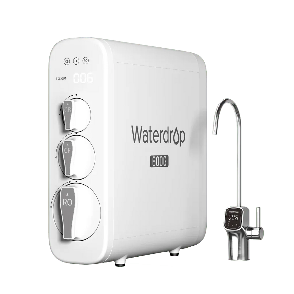 White rectangular Waterdrop 600G plastic water filter with three round dials and a metal faucet on a black background.