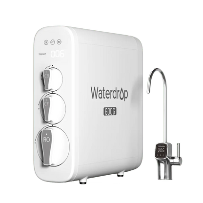 White rectangular Waterdrop 600G plastic water filter with three round dials and a metal faucet on a black background.